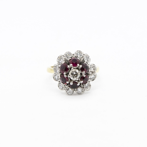 341 - A Diamond and Ruby Flower Cluster Ring, claw-set brilliant-cut diamond within frame of six round rub... 