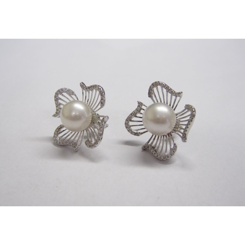 371 - A pair of Cultured Pearl and Diamond Flower Earrings, each with single cultured pearl within four pi... 