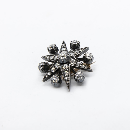 381 - A Victorian Diamond Star Brooch set throughout old and rose-cut stones, 30mm diameter.