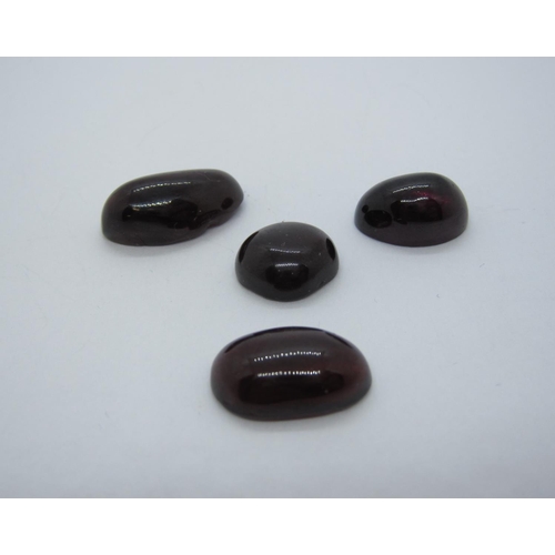 413 - Four unmounted Garnet Cabochons, total weight 52.60cts.