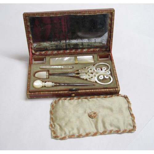 428 - A Palais Royal Sewing Kit in red morocco with gilt tooling, having fitted interior containing mother... 