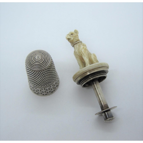 430 - A French silver Sewing Aide, the thimble with basket weave decoration having screw top with carved i... 