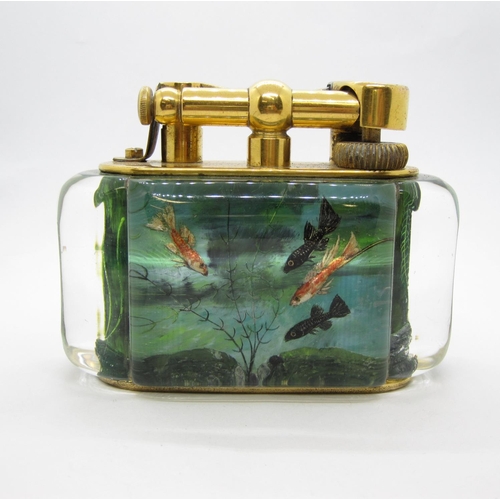 434 - A DUNHILL electroplated and lucite Aquarium Table Lighter having four reverse intaglio panels depict... 