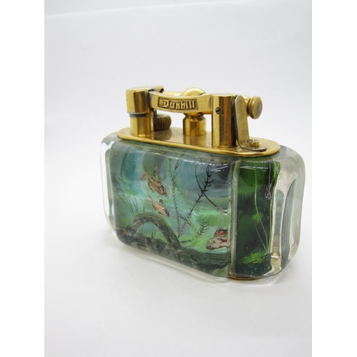 434 - A DUNHILL electroplated and lucite Aquarium Table Lighter having four reverse intaglio panels depict... 