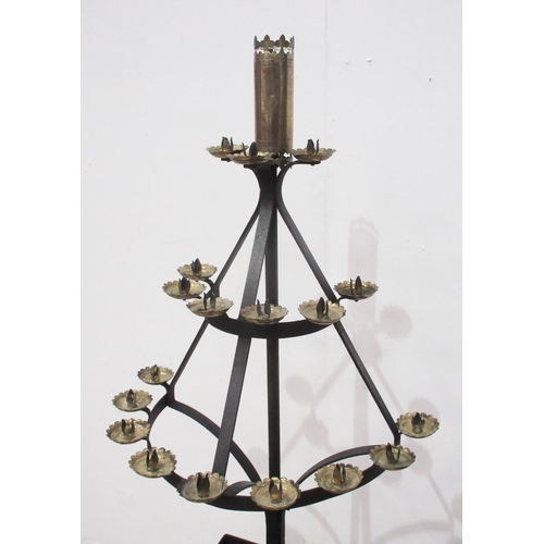 578 - A wrought iron Candle Stand, with three levels of brass candle holders, 4ft 10in H