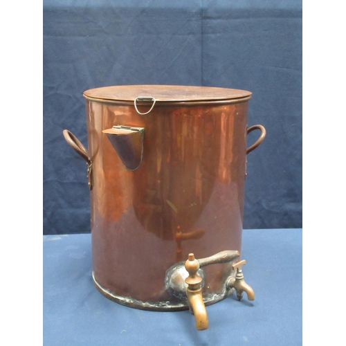 579 - A large copper Urn with earthenware line, opening to fill the hot water sleeve and two taps, 16 1/2i... 