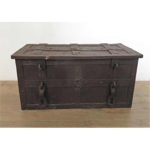 580 - An iron Armada Chest with hinged top opening to reveal ornate locking mechanism with iron carrying h... 