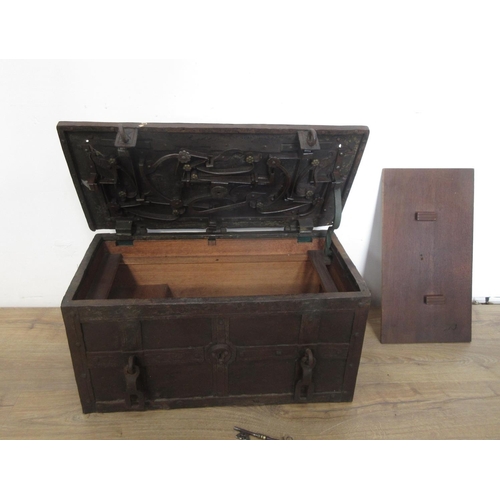 580 - An iron Armada Chest with hinged top opening to reveal ornate locking mechanism with iron carrying h... 