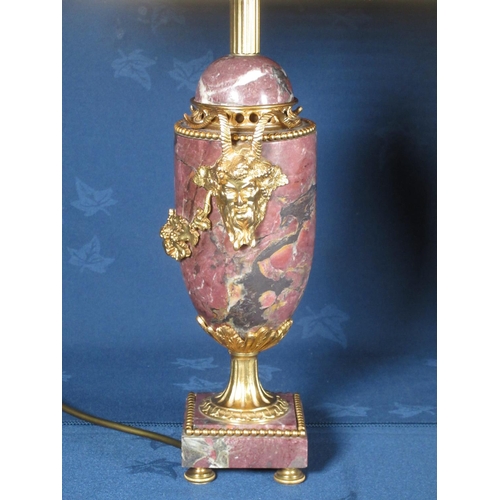 775 - A pair of mauve veined marble Table Lamps and Shades with gilt metal mounts of bacchus and trailing ... 