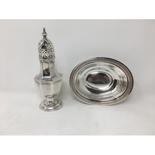 141 - An Edward VII silver octagonal Sugar Caster, Birmingham 1909 and an oval Bowl with leafage frieze, m... 