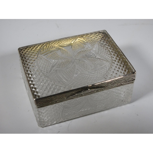 501 - A Continental cut glass lidded Box with silver mount.