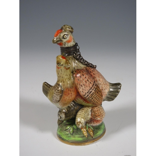 515 - A Chelsea porcelain Scent Bottle in the form of a chicken with three small hens on a circular domed ... 