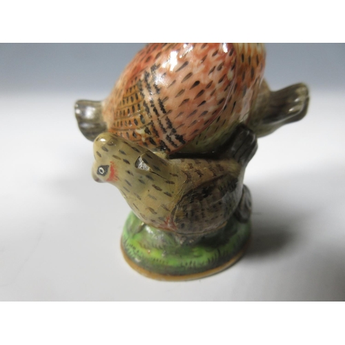 515 - A Chelsea porcelain Scent Bottle in the form of a chicken with three small hens on a circular domed ... 