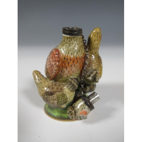 515 - A Chelsea porcelain Scent Bottle in the form of a chicken with three small hens on a circular domed ... 