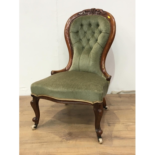 790 - A Victorian walnut framed spoon backed Nursing Chair with green button upholstery 3ft H