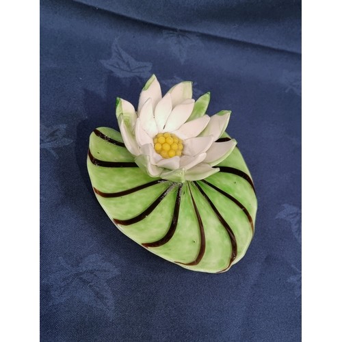 504 - A Continental opaque glass Water Lily on a leaf A/F and a large cut and engraved glass Vase commemor... 