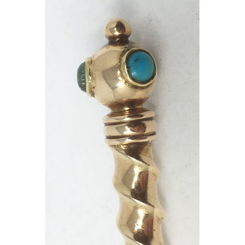 279 - A gold Spoon with pear shape bowl, spiral stem with knop finial set turquoise, ruby and emerald type... 