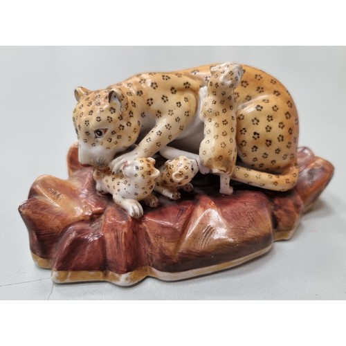 505 - A rare pair of Rockingham Leopards, single male on rocky base with painted detail and mother with th... 