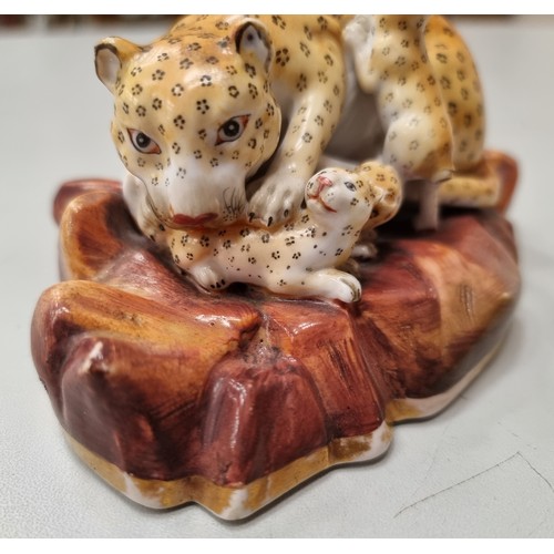 505 - A rare pair of Rockingham Leopards, single male on rocky base with painted detail and mother with th... 