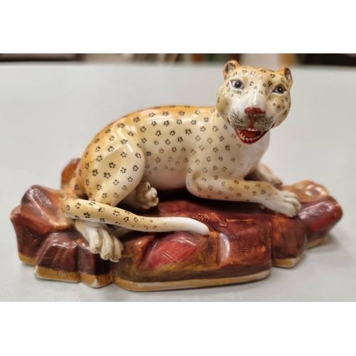 505 - A rare pair of Rockingham Leopards, single male on rocky base with painted detail and mother with th... 