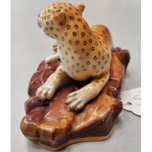 505 - A rare pair of Rockingham Leopards, single male on rocky base with painted detail and mother with th... 