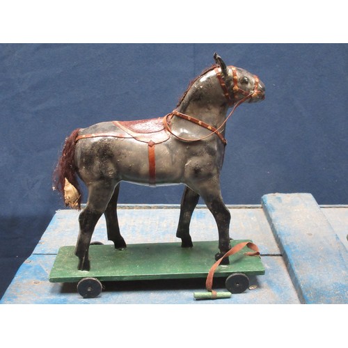 142 - An antique Folk Art blue painted pine Stable with four stalls, each containing a papier mache horse ... 