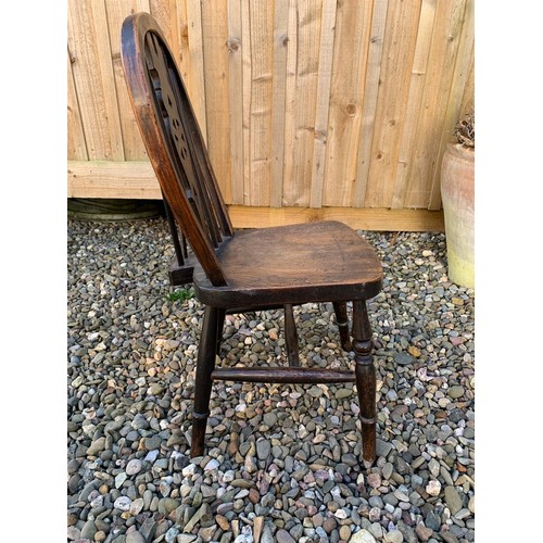 141 - A 19th Century ash and beech wheelback child's Chair on turned supports, 27in H