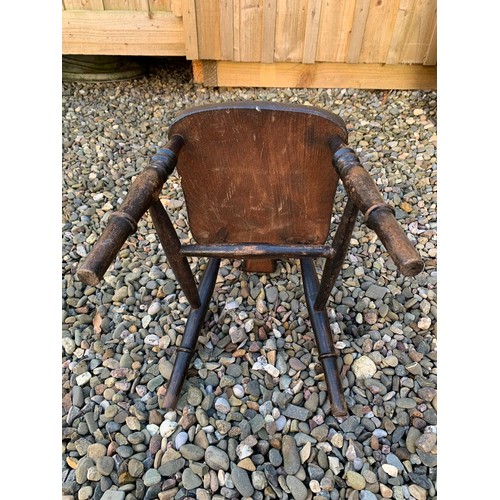 141 - A 19th Century ash and beech wheelback child's Chair on turned supports, 27in H