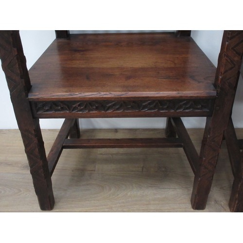 144 - A pair of oak Hall Chairs in the 15th Century Gothic style with tracery pierced backs, solid seats, ... 