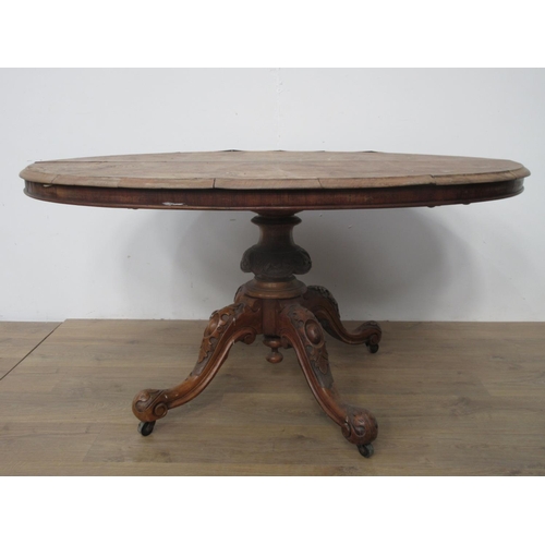 123 - A Victorian walnut veneered oval Breakfast Table on leafage carved supports 4ft 8in W x 2ft 4in H A/... 