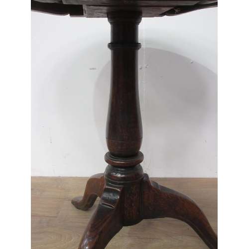 124 - An 18th Century oak Pillar Table on baluster turned column and pad feet 2ft 2in D