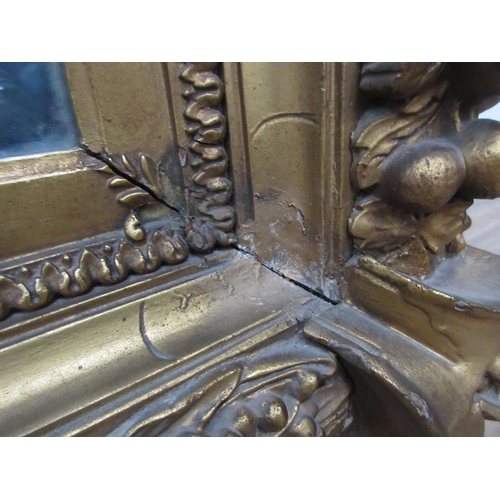 135 - A 19th Century gilt framed Wall Mirror with relief fruit and wheat decoration 3ft 2in W x 2ft 8in H