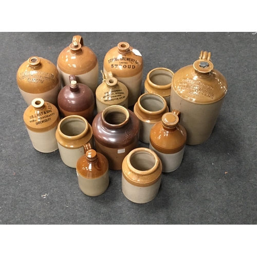 14 - Fourteen stoneware Flagons and Jars