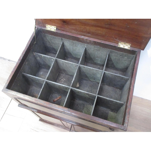 149 - A 19th Century mahogany Cellarette with hinged lid enclosing a compartmentalised metal lined interio... 