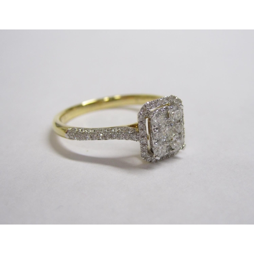 188 - A Diamond Cluster Ring pave-set brilliant-cut stones within rectangular halo frame set smaller stone... 