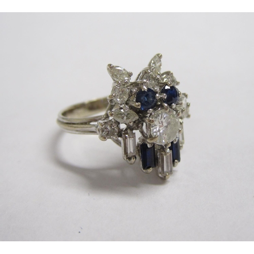 189 - An Art Deco style Diamond and Sapphire Cluster Ring, claw-set baguette, marquise and brilliant-cut d... 