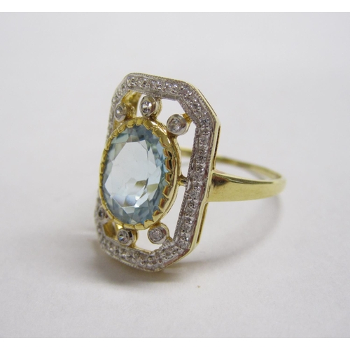 193 - An Aquamarine and CZ Dress Ring set oval-cut aquamarine within openwork rectangular frame set cz, ri... 