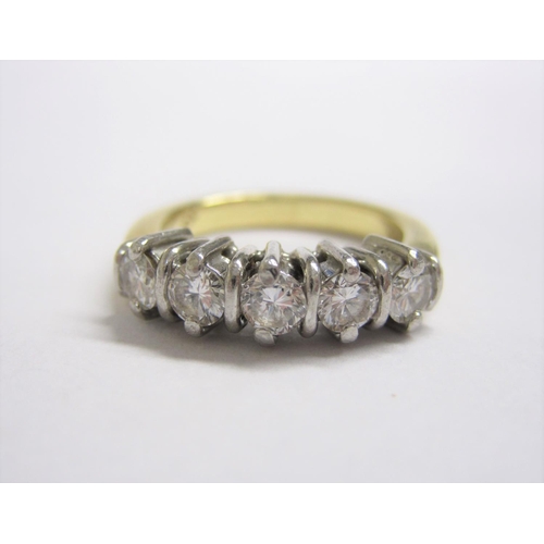 194 - A Diamond five stone Ring claw-set brilliant-cut stones, in white and yellow gold, stamped K18, ring... 