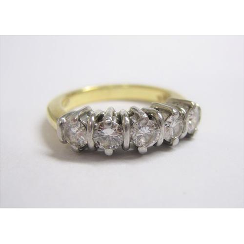 194 - A Diamond five stone Ring claw-set brilliant-cut stones, in white and yellow gold, stamped K18, ring... 