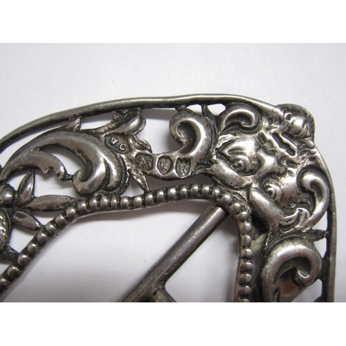 212 - A Victorian silver Buckle pierced and embossed masks and fruit, London 1892, maker WC, a 1930’s silv... 