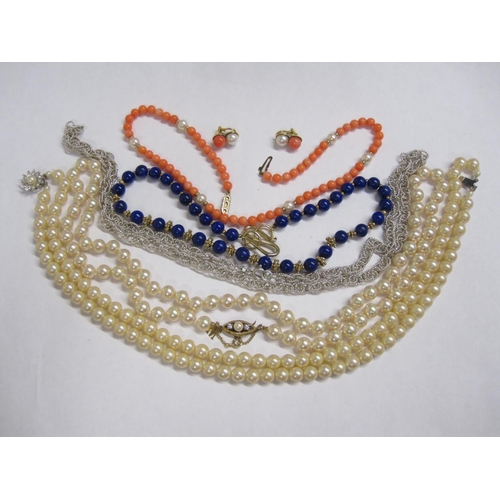 215 - A Lapis Lazuli Bead Necklace, a white metal triple link Chain stamped 925, a single row and a double... 