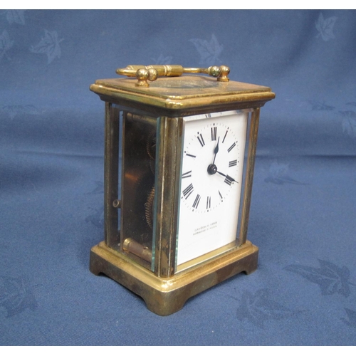 235 - A brass cased Carriage Clock, 4 in H.