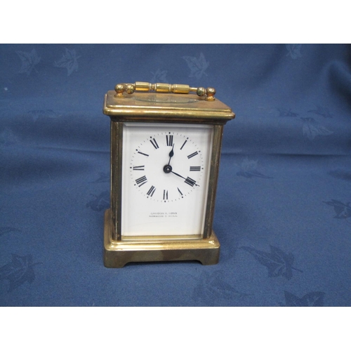 235 - A brass cased Carriage Clock, 4 in H.