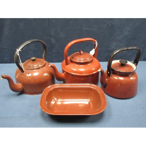 28 - A collection of brown enamel kitchen items including Tea Pots, Kettles, Milk Can, two double Sauce P... 