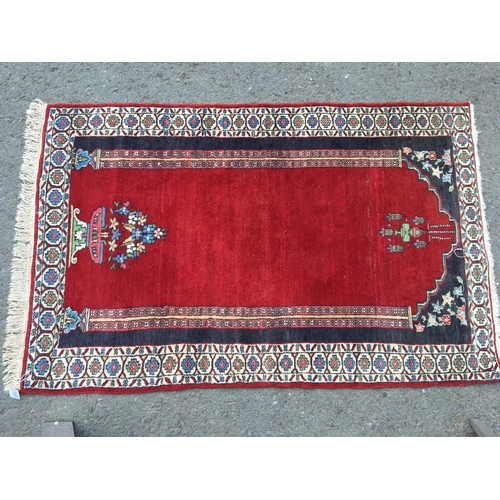 313 - A small Persian Prayer Rug with red ground, 5ft x 3ft 2in, a small Persian Rug and two modern Rugs