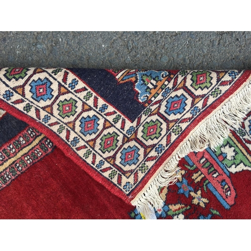 313 - A small Persian Prayer Rug with red ground, 5ft x 3ft 2in, a small Persian Rug and two modern Rugs