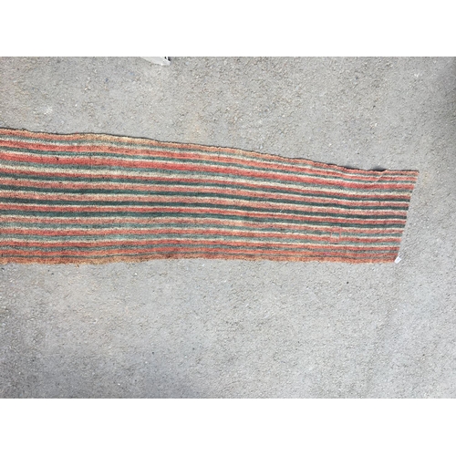 316 - An Anatolian Runner with striped design in red, green and cream, 14ft 6in L x 2ft 4in W