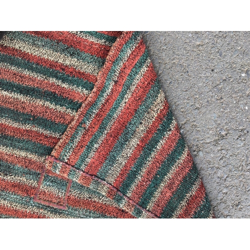 316 - An Anatolian Runner with striped design in red, green and cream, 14ft 6in L x 2ft 4in W