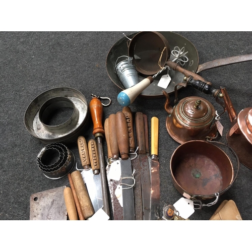 32 - A collection of copper Tea Pots, Kettles, Frying Pan, Pastry Cutters, copper Fish Mould, comedy Cork... 