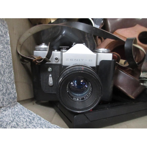 397 - A wicker hamper and a box of Cameras and Lenses including Bell & Howell, Mamiya, Kodak, etc